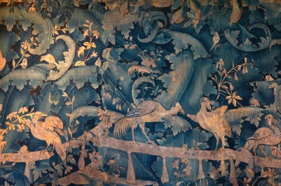 A tapestry hanging in one of the châteaux rooms. The bright colors served to seemingly give warmth on cold winter days.