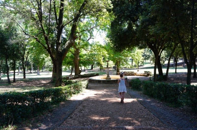 Dana walking through Villa Borghese gardens.